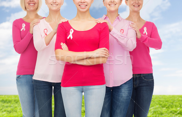 Stock photo: close up of women with cancer awareness ribbons