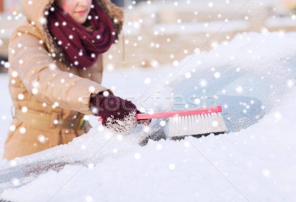 closeup of woman cleaning snow from car Stock photo © dolgachov