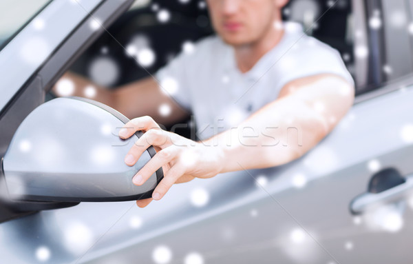 close up of man adjusting car sideview mirror Stock photo © dolgachov