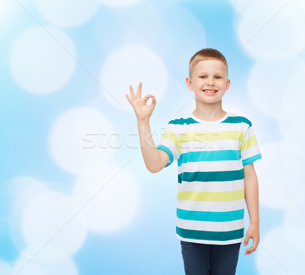 little boy in casual clothes making OK gesture Stock photo © dolgachov