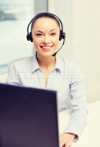 Stock photo: friendly female helpline operator