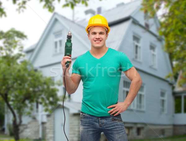 Heureux Homme constructeur casque électriques forage [[stock_photo]] © dolgachov