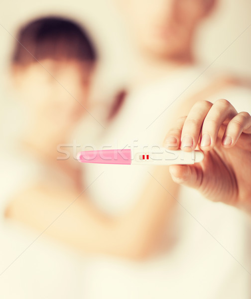 Stock photo: woman and man hands with pregnancy test