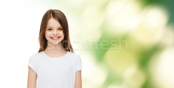 Souriant petite fille blanche tshirt publicité enfance [[stock_photo]] © dolgachov