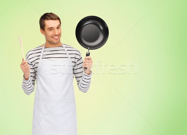 Heureux homme Cook tablier pan cuillère [[stock_photo]] © dolgachov