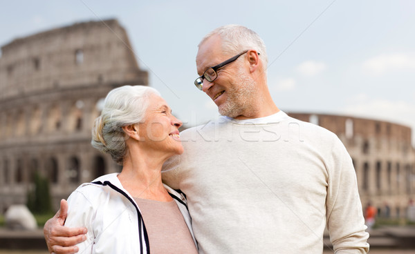 happy senior couple over coliseum in rome, italy Stock photo © dolgachov