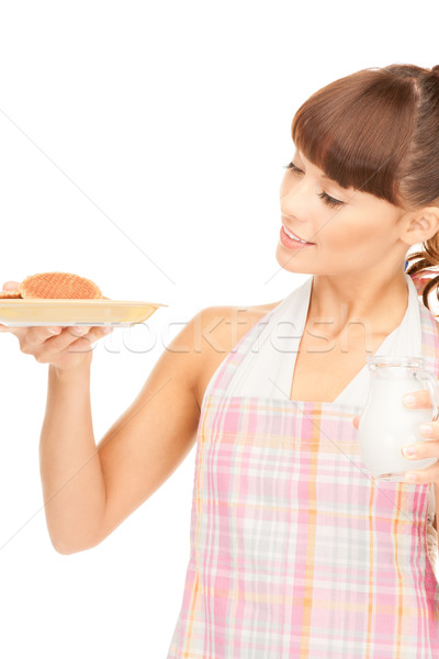 housewife with milk and cookies Stock photo © dolgachov