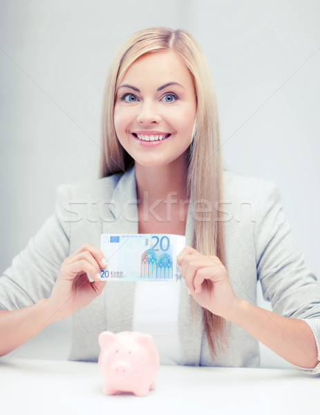 woman with piggy bank and cash money Stock photo © dolgachov