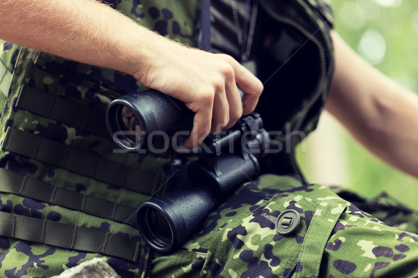 close up of soldier or hunter with binocular Stock photo © dolgachov