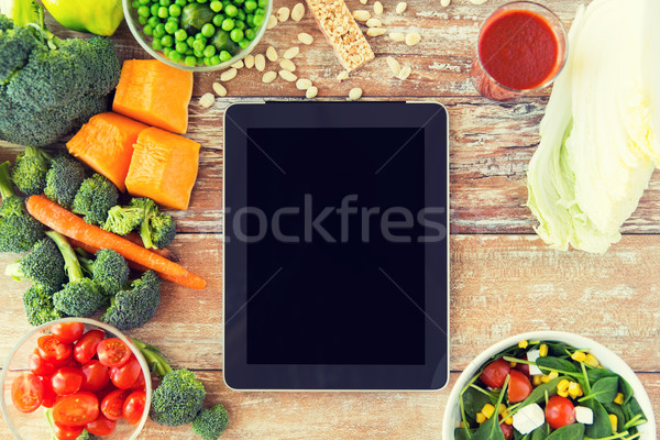 close up of blank tablet pc screen and vegetables Stock photo © dolgachov