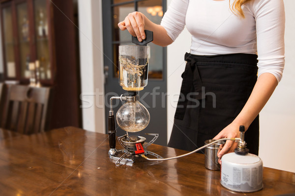 close up of woman with siphon coffee maker and pot Stock photo © dolgachov