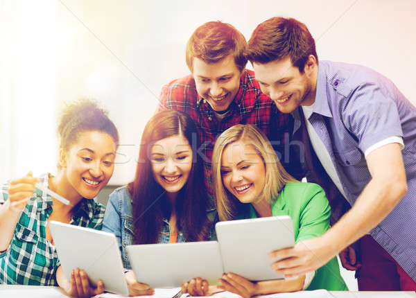 students looking at tablet pc in lecture at school Stock photo © dolgachov