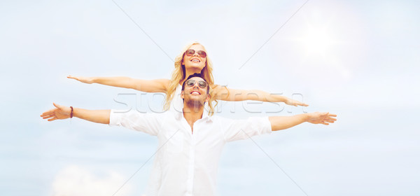 couple holding hands up at sea side Stock photo © dolgachov