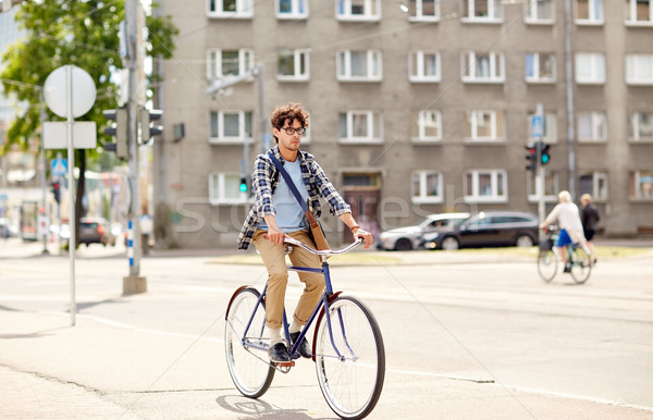 Jeunes homme sac équitation fixé [[stock_photo]] © dolgachov