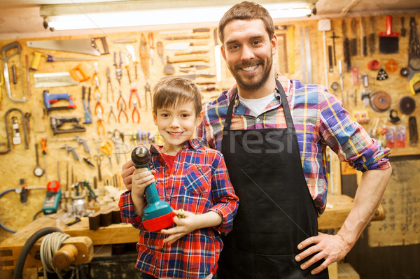 Filho pai três de um tipo trabalhando oficina família carpintaria Foto stock © dolgachov