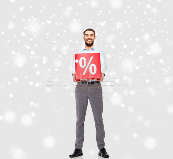 Souriant homme rouge pourcentage signe neige [[stock_photo]] © dolgachov