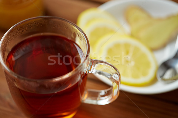 tea cup with lemon and ginger on plate Stock photo © dolgachov