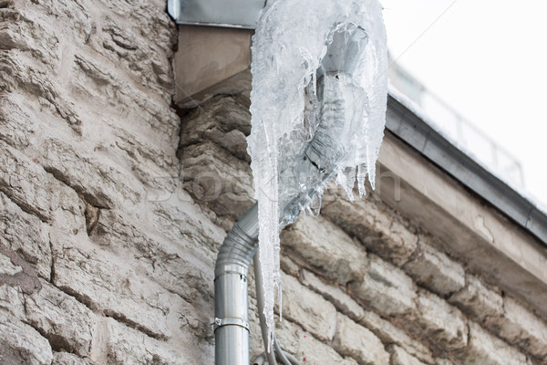 icicles hanging from building drainpipe Stock photo © dolgachov