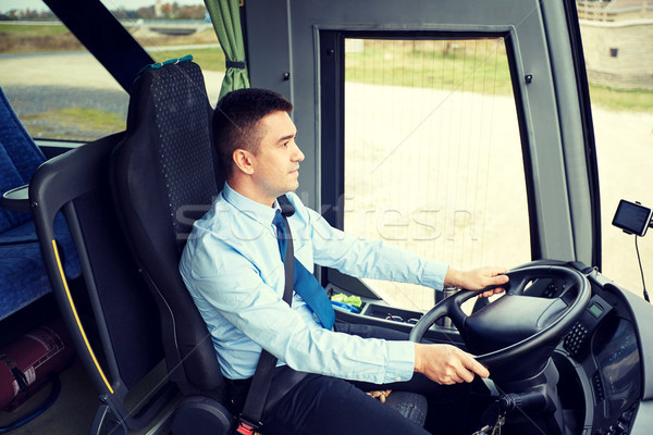 happy driver driving intercity bus Stock photo © dolgachov