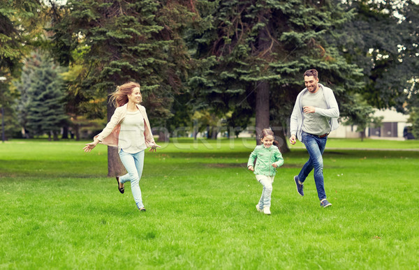 happy family walking in summer park Stock photo © dolgachov
