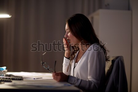 Stanco donna occhiali notte ufficio Foto d'archivio © dolgachov