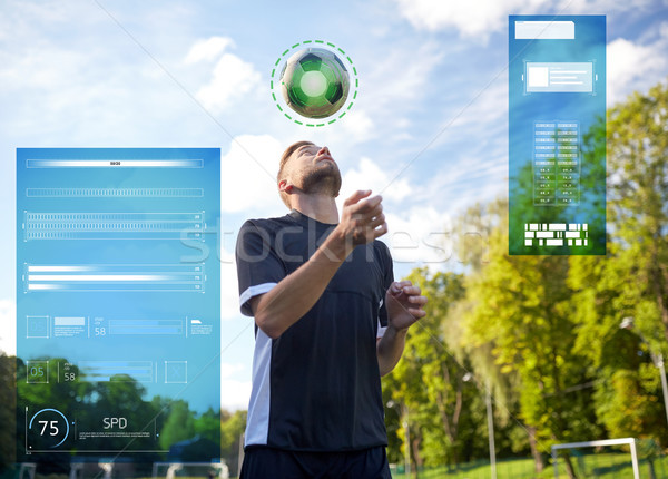 soccer player playing with ball on field Stock photo © dolgachov