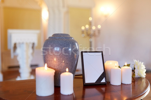photo frame, cremation urn and candles in church Stock photo © dolgachov