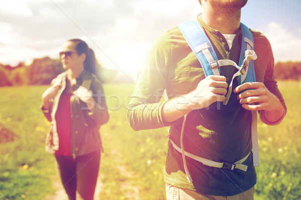 close up of couple with backpacks hiking outdoors Stock photo © dolgachov