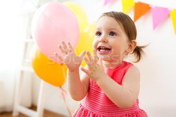 happy baby girl on birthday party at home Stock photo © dolgachov