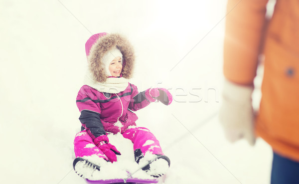 happy little kid on sled outdoors in winter Stock photo © dolgachov