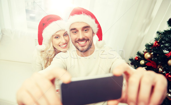 Para smartphone christmas wakacje technologii Zdjęcia stock © dolgachov