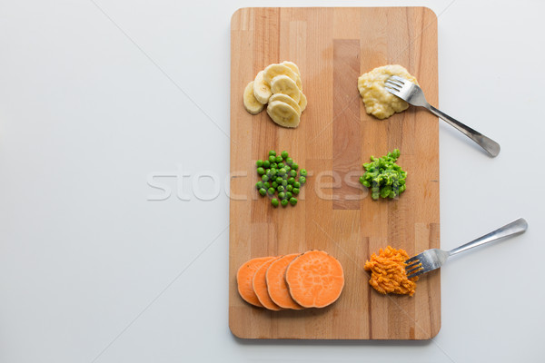 mashed fruits and vegetables with forks on board Stock photo © dolgachov