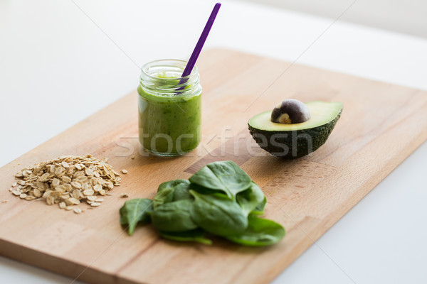 Stock photo: jar with puree or baby food on wooden board