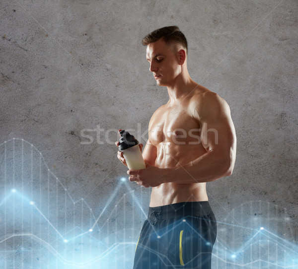young man or bodybuilder with protein shake bottle Stock photo © dolgachov