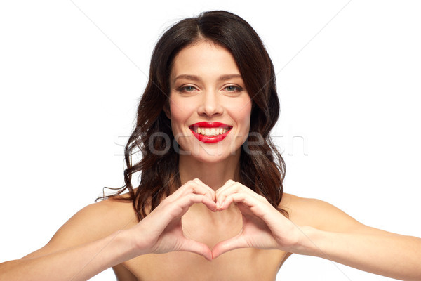 Bela mulher batom vermelho mão coração dia dos namorados beleza Foto stock © dolgachov