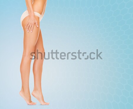 Longues jambes bikini culottes sable blanc photos bleu Photo stock © dolgachov