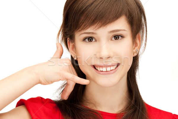 teenage girl making a call me gesture Stock photo © dolgachov