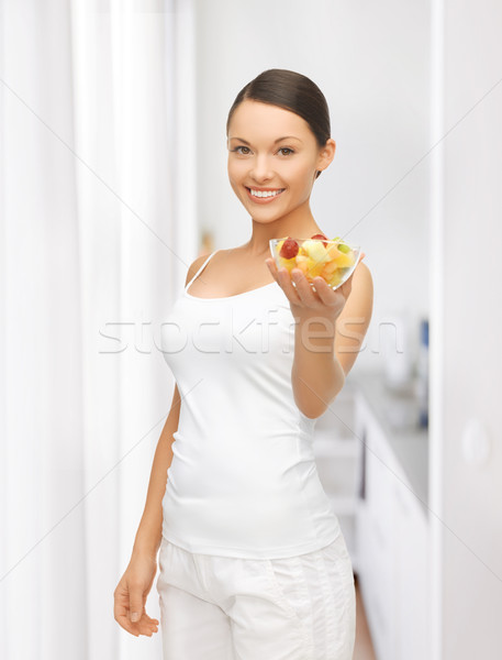 Saudável mulher tigela salada de frutas quadro Foto stock © dolgachov