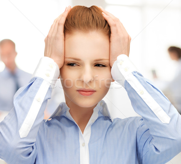 Boldogtalan nő tart fej kezek munka Stock fotó © dolgachov