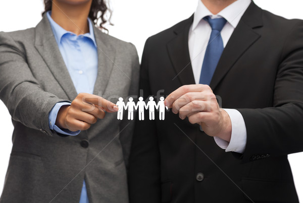 businessman and businesswoman holding paper team Stock photo © dolgachov