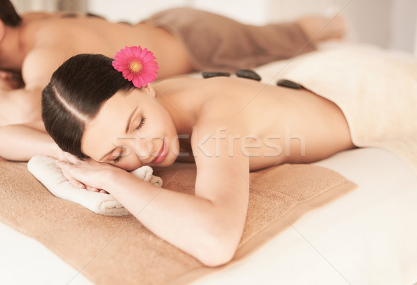 Stock photo: couple in spa with hot stones
