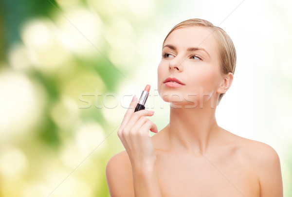 Mujer hermosa lápiz de labios cosméticos salud belleza rosa Foto stock © dolgachov