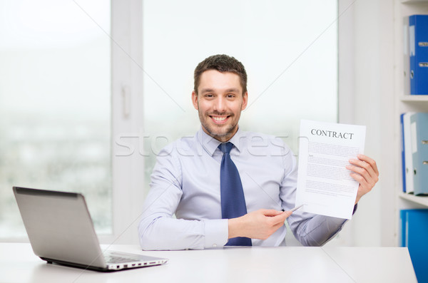 businessman with laptop and contract at office Stock photo © dolgachov