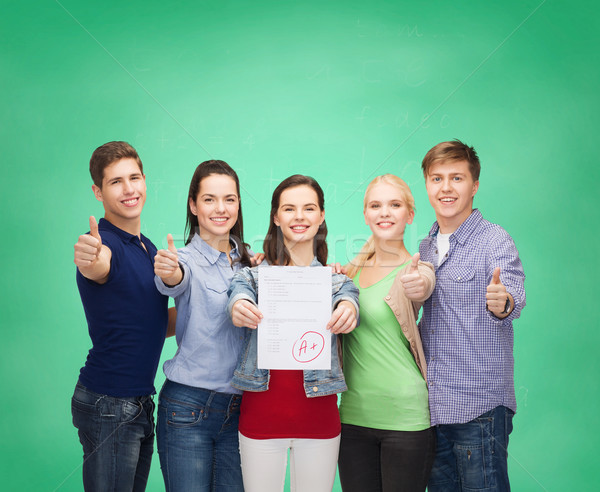 group of students showing test and thumbs up Stock photo © dolgachov