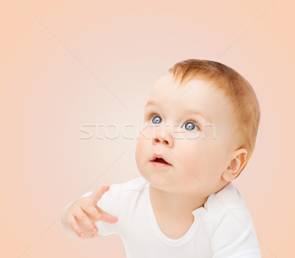 curious baby looking up Stock photo © dolgachov
