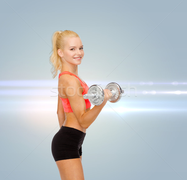 Jonge vrouw zwaar staal Stockfoto © dolgachov