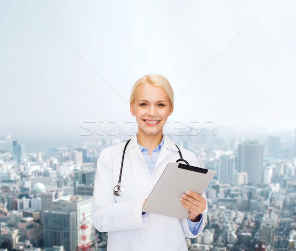 female doctor with stethoscope and tablet pc Stock photo © dolgachov