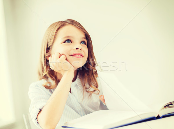 student girl writing in notebook at school Stock photo © dolgachov