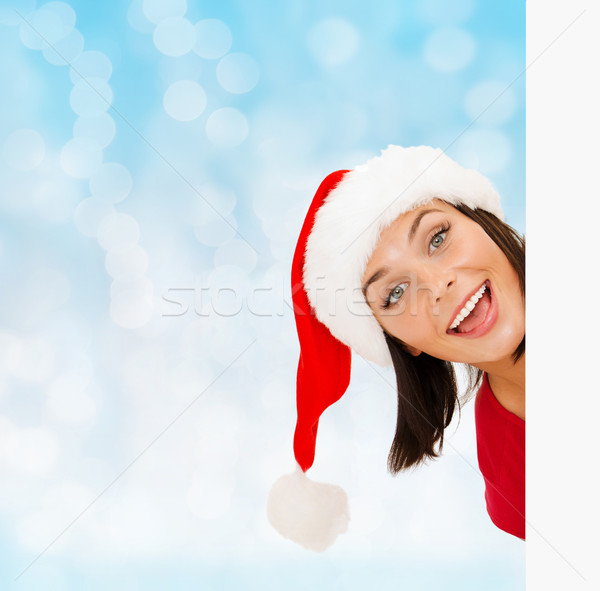 woman in santa helper hat with blank white board Stock photo © dolgachov