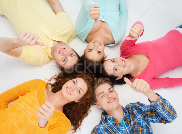 group of smiling teenagers Stock photo © dolgachov